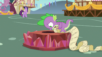 Spike looks at the Flame of Friendship torch S7E15