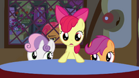 Apple Bloom standing at the table S3E4