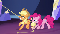 Pinkie and Applejack hoisting the chandelier S5E3