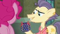 Pouch Pony holding up rock pouch S6E3