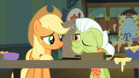 Granny Smith, winking at Applejack.