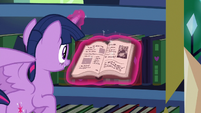 Twilight opens book to Puddinghead page MLPBGE