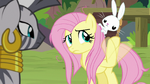 Fluttershy swatting her hoof at Angel S9E18