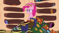 Pinkie Pie emerges from a pile of books S3E05