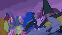 Princess Luna's cloak flutters in the wind...