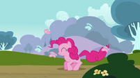 Pinkie happily bouncing.