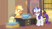 Rarity putting rolls of fabric onto a table S4E08