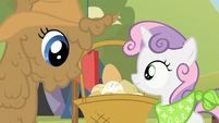 Sweetie Belle and mud covered Rarity look at eggs S2E05