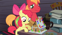 Apple Bloom and Big McIntosh looking at the gingerbread house S4E09