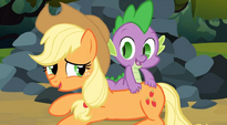 Applejack trying to talk to Spike while he is scratching her back S3E9
