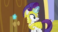 Rarity uses medal to open the castle doors S9E4