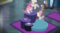 Snooty Fluttershy walking behind a display S8E4