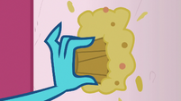 Ember smears Derpy's muffin on a wall S7E15