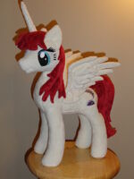 A Fausticorn plushie