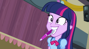 Twilight holding a pen in her mouth EG