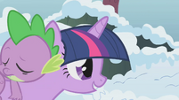 Twilight carrying a sleeping Spike S1E11