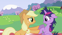 Applejack pushing Twilight Sparkle's hoof S2E03