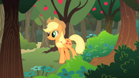 Applejack walking past apple orchard S01E18