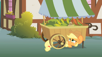 Applejack hiding under a vegetable stand S1E15