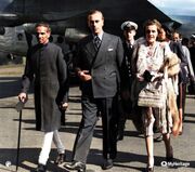 VK Krishna Menon, Lord Mountbatten, and Lady Mountbatten walk, with Prince Philip in background