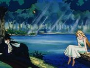 Diego (Zorro) sitting on the grass and Lolita sitting on the log with her bare feet in the water in the outro.