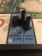 A power station, a hazard. Monopoly City has 3 of this. You can build a power station when you land on the fourth Planning Permission board space. This building takes up 3 blocks. To remove this hazard, pay $1.5M.