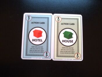 The house and hotel in Monopoly Deal.