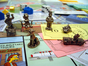 Token in the game from left to right: Jebediah Springfield, Kang, Santa's Little Helper, Homer, Three Eyed Fish and Bart.