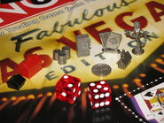 Tokens, buildings and casino-style dice.