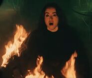 Angela setting her on fire.