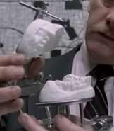 The police’s recreation of the fake teeth he bites his victims with.
