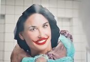 Elisasue Monster Wearing a Picture of Elisabeth as a Mask