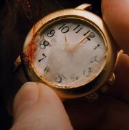 Lucas' signature. Leaving behind watches to let the others know when the next trap will come.
