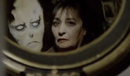 Martha’s face in the mirror.