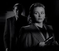 Kiki baiting Galbraith into revealing himself by attempting to attack her.