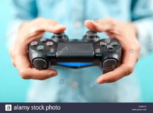 Male-hands-holding-a-ps4-controller-MM3X39.jpg