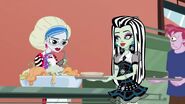 Ghoulia as a lunch lady serving lunch along with Frankie to earn money for her scooter.