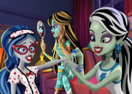 Frankie Stein paints Ghoulia's nails.