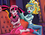 Draculaura and Lagoona; chillaxing in the Dead Tired advert.