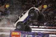 George Balhan running a white body on An Escalade.
