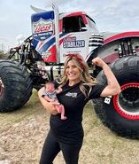 Cynthia with her newborn daughter in front of Lucas Stabilizer.