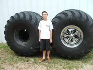 An Escalade's spinning rims (right).