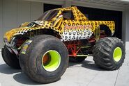 Pouncer with two front "plain" tires, one of the very few times they have ever been used on a racing truck. Also, the back tires are backwards.