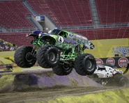Grave Digger 27 piloted by Charlie Pauken with its green design for Monster Jam World Finals 16.