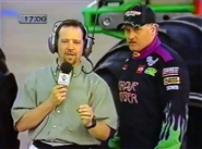 Dennis Anderson standing in front of Grave Digger 10 at the World Finals 2 pre-show.