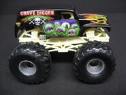 20th Anniversary Hot Wheels toy with a glow-in-the-dark rollcage