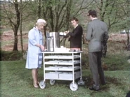 Mrs Wills serving drinks