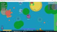 A hippo and a swordfish next to an island in the ocean.
