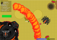 The King Dragon using its "Fire Stream" onto a Queen Blackwidow.