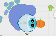 An Aqua Yeti in the arctic with a pumpkin.